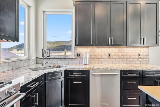 255 Flannigan Cir, Alma, CO 80420 - kitchen featuring a sink, appliances with stainless steel finishes, backsplash, and a healthy amount of sunlight