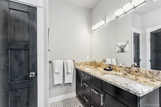 255 Flannigan Cir, Alma, CO 80420 - bathroom featuring a sink, baseboards, tile patterned floors, and double vanity