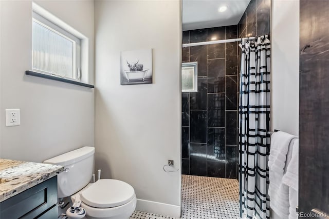 255 Flannigan Cir, Alma, CO 80420 - full bathroom featuring toilet, baseboards, a tile shower, and vanity