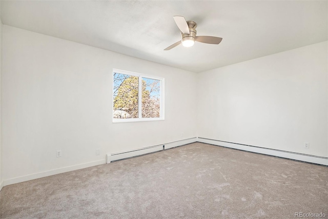 spare room with baseboard heating, ceiling fan, and light carpet