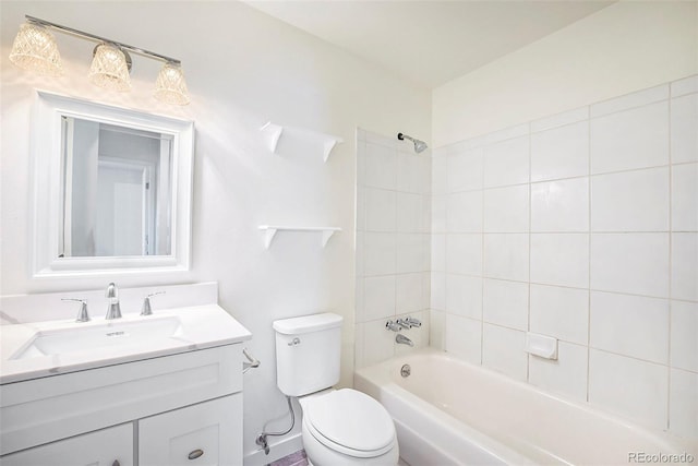 full bathroom with tiled shower / bath combo, vanity, and toilet