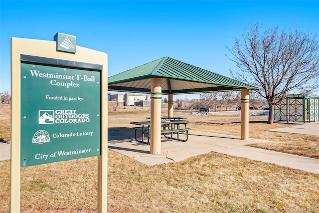 view of community featuring a storage shed, a gazebo, and a lawn