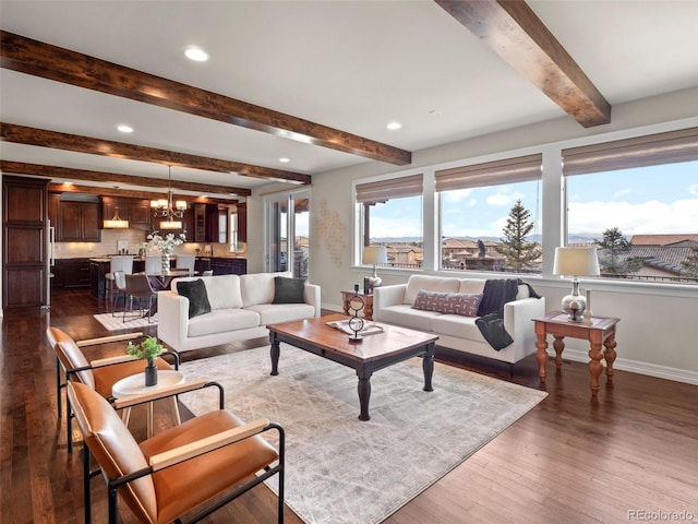 living room with dark hardwood / wood-style floors, a notable chandelier, and beam ceiling