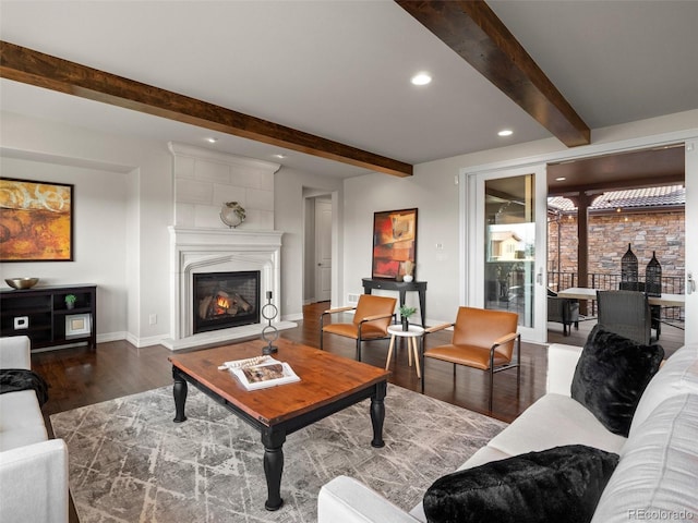 living room featuring beam ceiling and dark wood-type flooring