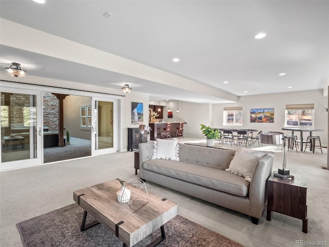 carpeted living room with french doors