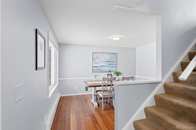 interior space featuring hardwood / wood-style floors and baseboard heating