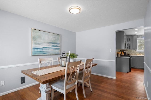 dining area featuring dark hardwood / wood-style flooring