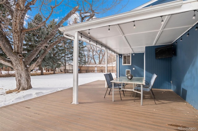 view of snow covered deck