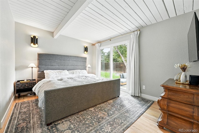 1440 S Clermont St, Denver, CO 80222 - bedroom with access to exterior, wood finished floors, wooden ceiling with exposed beams, and baseboards