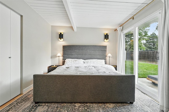 1440 S Clermont St, Denver, CO 80222 - bedroom with access to exterior, beamed ceiling, and wood finished floors