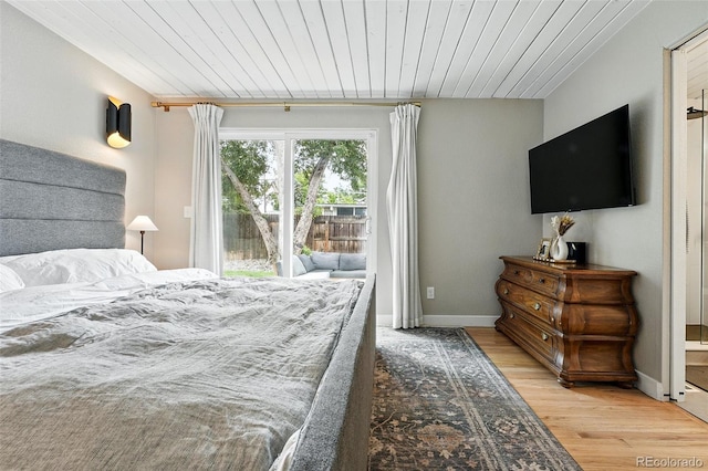 1440 S Clermont St, Denver, CO 80222 - bedroom featuring access to exterior, light wood-type flooring, wooden ceiling, and baseboards