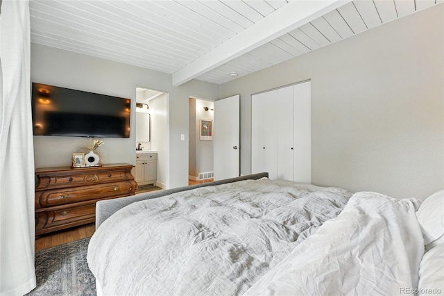 1440 S Clermont St, Denver, CO 80222 - bedroom with ensuite bathroom, a closet, and wooden ceiling with exposed beams