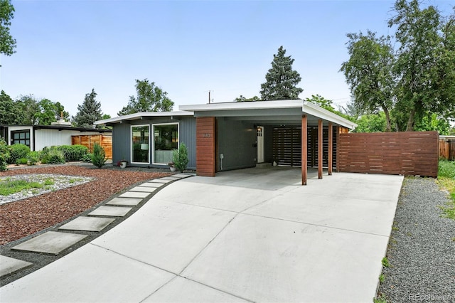 1440 S Clermont St, Denver, CO 80222 - view of front of home with driveway and an attached carport