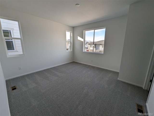 view of carpeted spare room