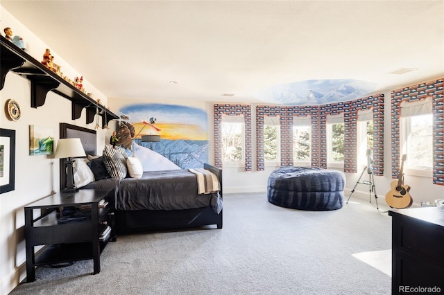 carpeted bedroom featuring baseboards