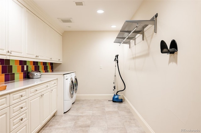 clothes washing area featuring recessed lighting, baseboards, visible vents, separate washer and dryer, and cabinet space