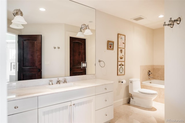full bathroom with toilet, vanity, visible vents, tiled tub, and baseboards