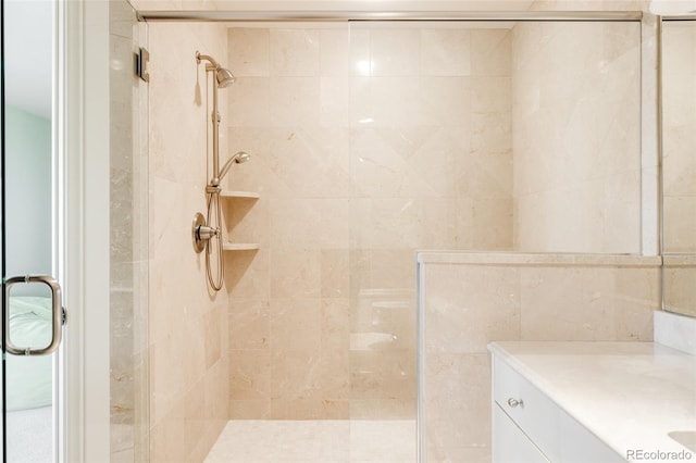 full bathroom with a shower stall and vanity