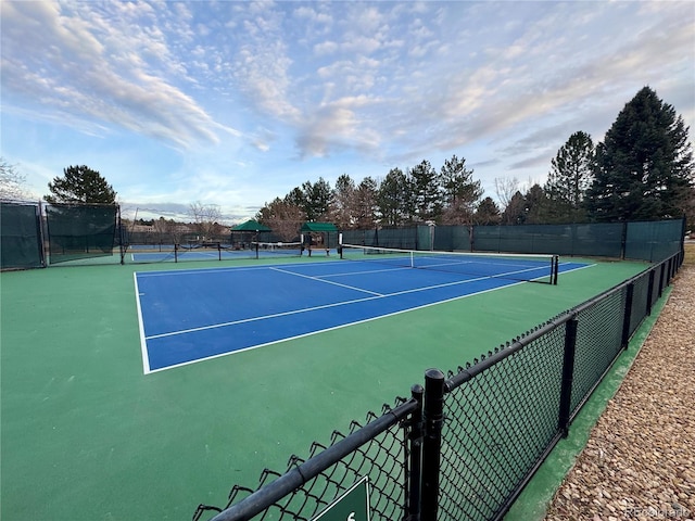 view of sport court with fence