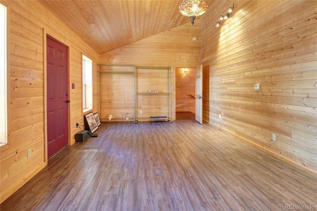 1245 Blossom Rd, Woodland Park, CO 80863 - unfurnished room featuring hardwood / wood-style flooring, lofted ceiling, wooden ceiling, and wooden walls