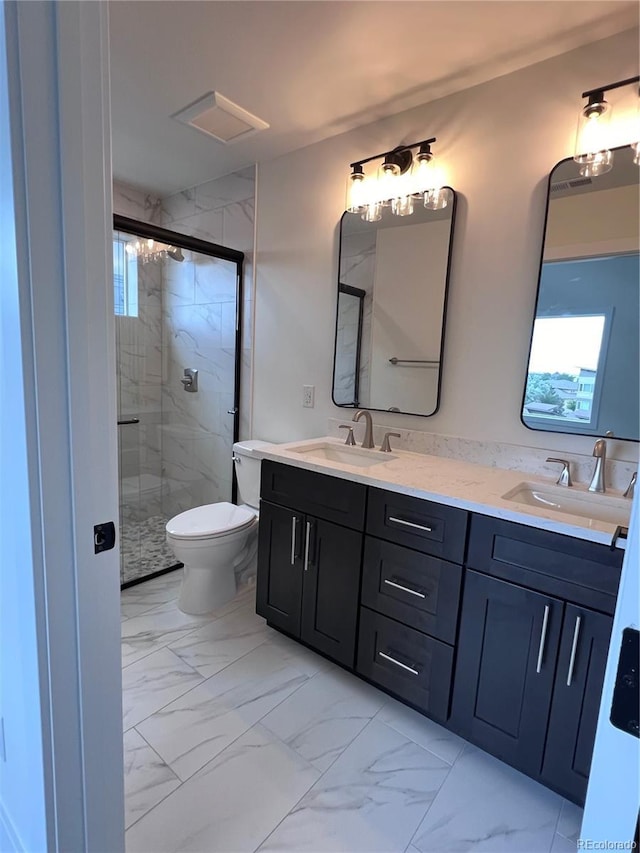 bathroom featuring vanity, toilet, and walk in shower