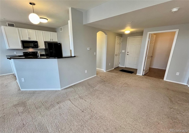 kitchen featuring pendant lighting, black appliances, white cabinets, light colored carpet, and kitchen peninsula