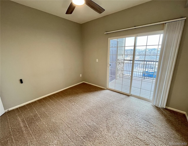 unfurnished room featuring ceiling fan and carpet