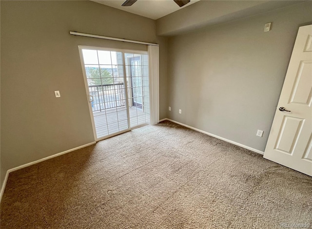 carpeted spare room with ceiling fan