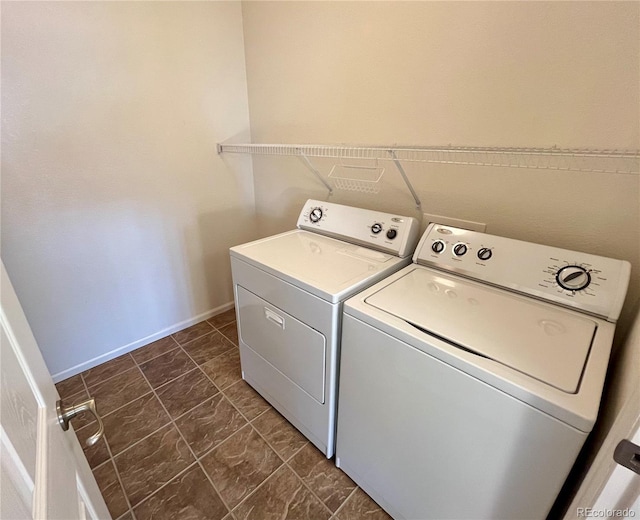 clothes washing area with independent washer and dryer