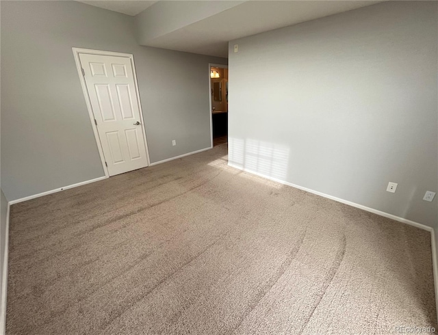 unfurnished room with carpet floors