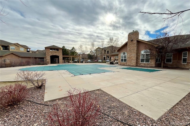 view of swimming pool with a patio area