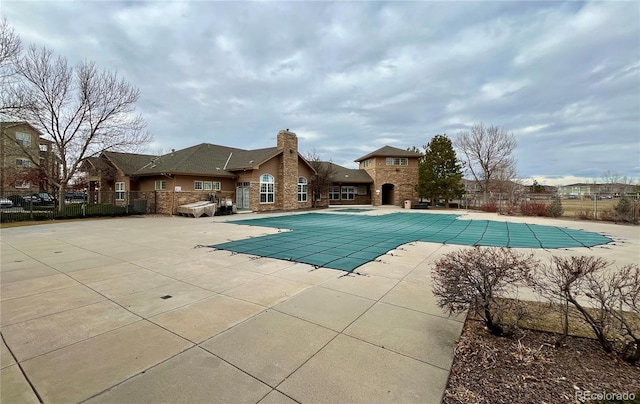 view of swimming pool featuring a patio area