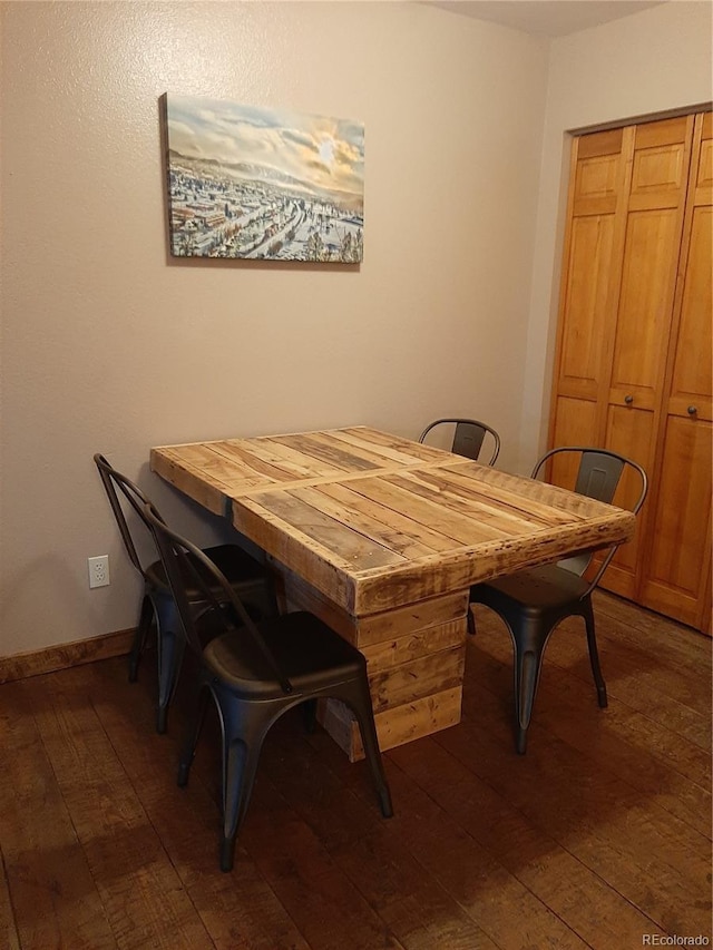1525 Shadow Run Frontage Unit 204, Steamboat Springs, CO 80487 - dining area with dark wood-type flooring and baseboards
