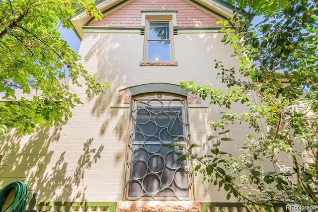 exterior space featuring brick siding