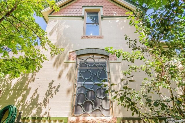 2227 N Gilpin St, Denver, CO 80205 - exterior space featuring brick siding