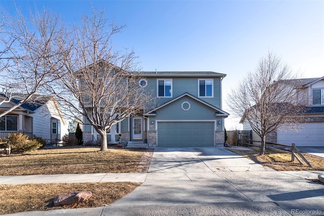 traditional home featuring concrete driveway, fence, and brick siding