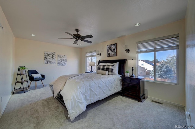 carpeted bedroom with recessed lighting, visible vents, baseboards, and a ceiling fan