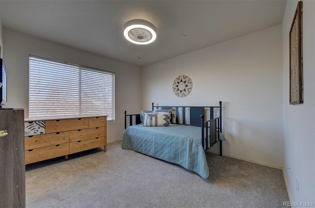 carpeted bedroom with baseboards