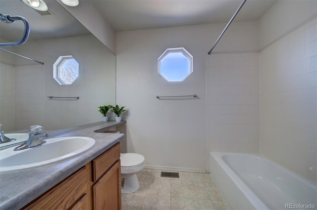 bathroom featuring visible vents, baseboards, shower / washtub combination, toilet, and vanity