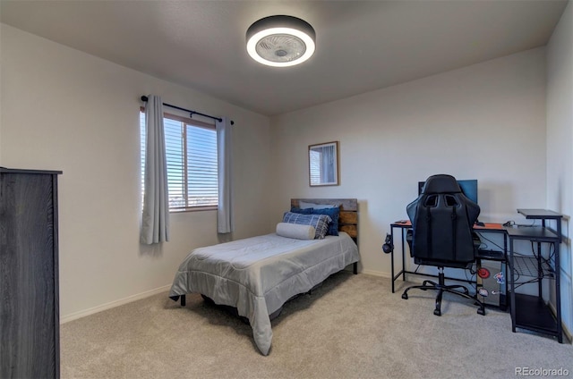 carpeted bedroom with baseboards