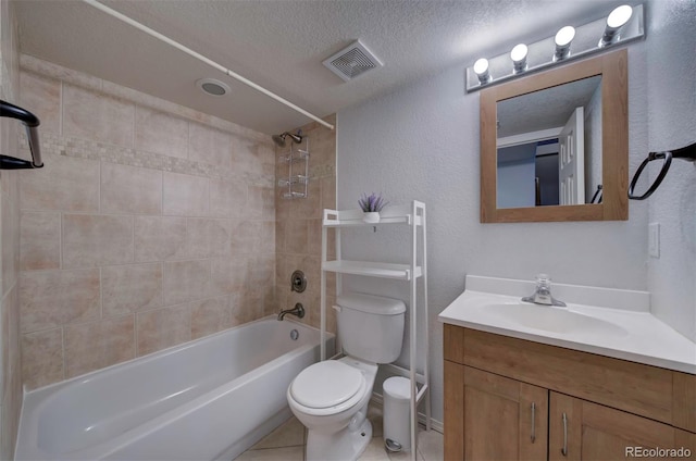 bathroom with vanity, visible vents, a textured ceiling, bathing tub / shower combination, and toilet