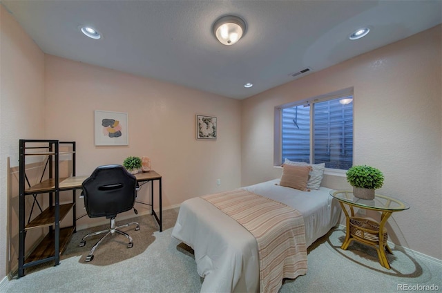 carpeted bedroom featuring visible vents, recessed lighting, and baseboards