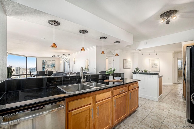 1625 Larimer St Unit 2601, Denver, CO 80202 - kitchen featuring appliances with stainless steel finishes, dark countertops, hanging light fixtures, and brown cabinets