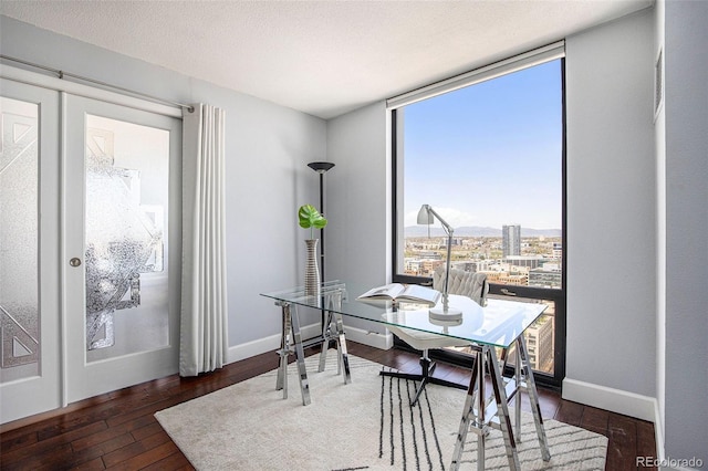 1625 Larimer St Unit 2601, Denver, CO 80202 - dining space with a wall of windows and hardwood / wood-style flooring