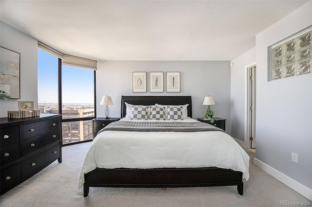 1625 Larimer St Unit 2601, Denver, CO 80202 - carpeted bedroom featuring baseboards