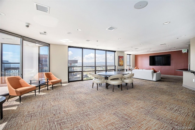 1625 Larimer St Unit 2601, Denver, CO 80202 - carpeted dining space with a wall of windows and baseboards