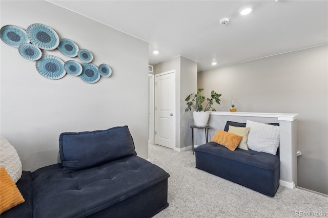 living area featuring light colored carpet