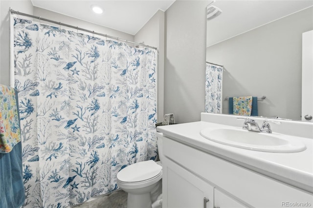 bathroom featuring vanity and toilet