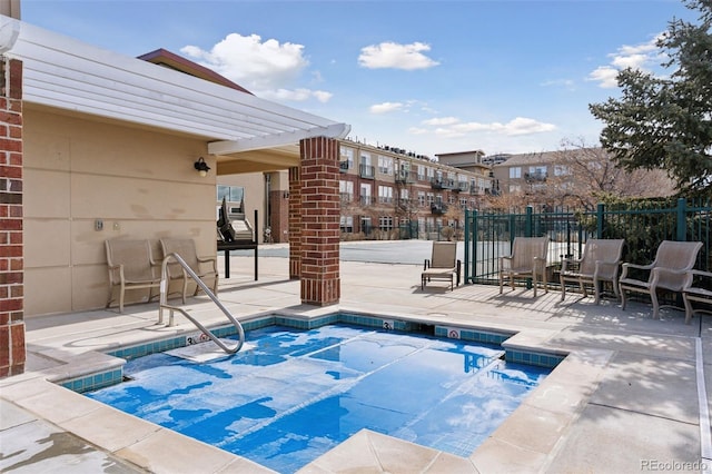 view of pool featuring a patio area and fence