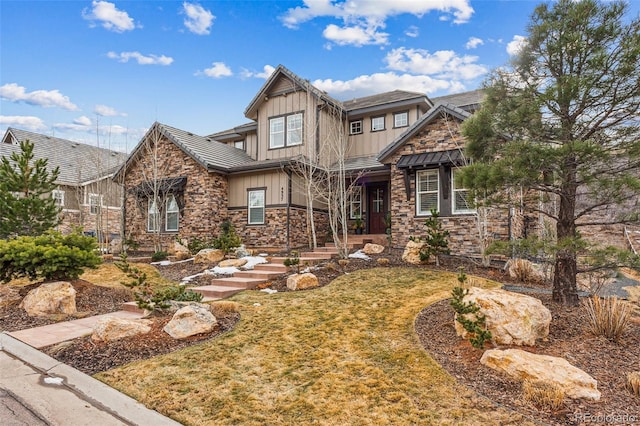 craftsman house with a front lawn